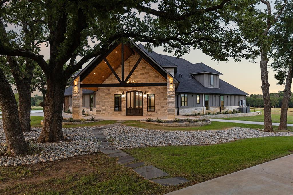 12877 Foutch Road Pilot Point, TX 76258 - Photo 39 of 40 a front view of a house with garden