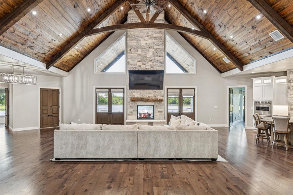 12877 Foutch Road Pilot Point, TX 76258 - Photo 8 of 40 a living room with stainless steel furniture granite countertop a couch a large window with outer view