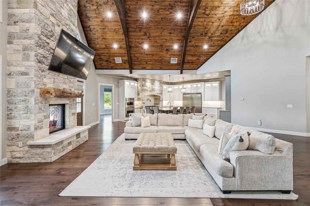 12877 Foutch Road Pilot Point, TX 76258 - Photo 10 of 40 a living room with furniture and a fireplace