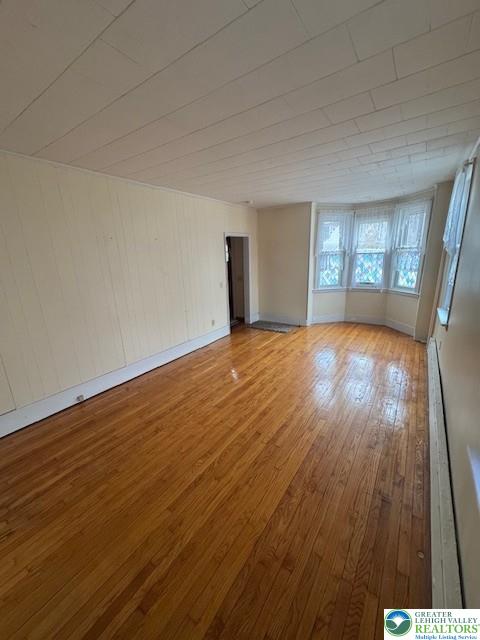 570 Slateford Road Mount Bethel, PA 18343 - Photo 2 of 10 a view of an empty room with wooden floor and a window