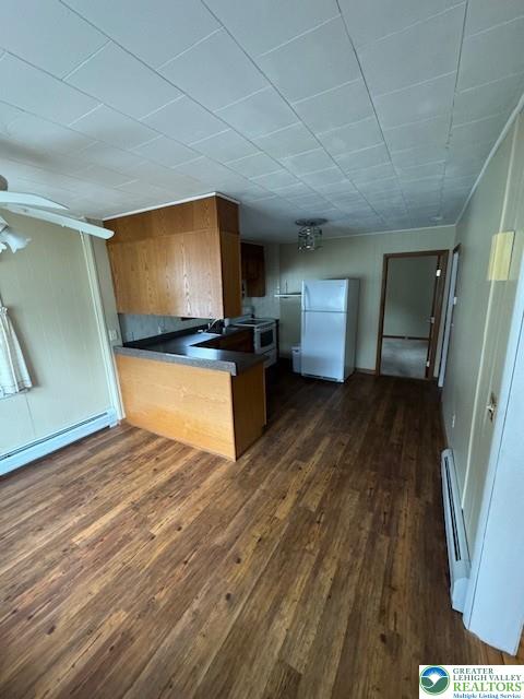 570 Slateford Road Mount Bethel, PA 18343 - Photo 3 of 10 a view of a livingroom with wooden floor and kitchen space