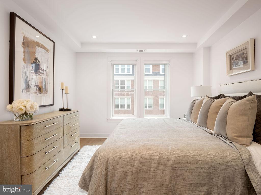 8551 Connecticut Avenue, Unit 411 Chevy Chase, MD 20815 - Photo 24 of 25 a bedroom with a large bed and a window