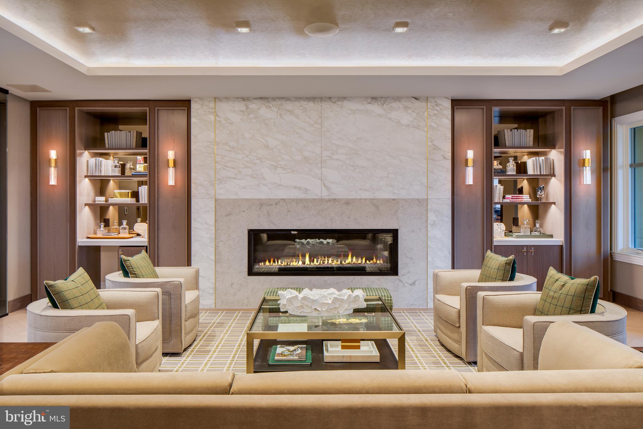 8551 Connecticut Avenue, Unit 411 Chevy Chase, MD 20815 - Photo 6 of 25 a living room with furniture and a fireplace