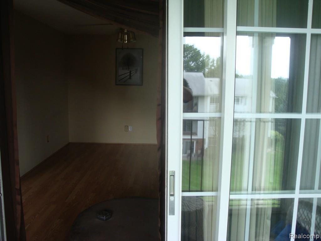430 Baldwin Avenue, Unit 75 Rochester, MI 48307 - Photo 12 of 17 Living room from balcony