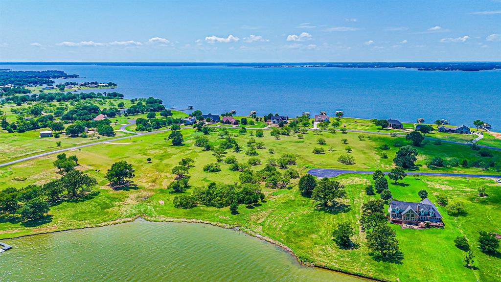 L77 R Moonlight Bay Court Streetman, TX 75859 - Photo 11 of 30 a view of a garden with an ocean
