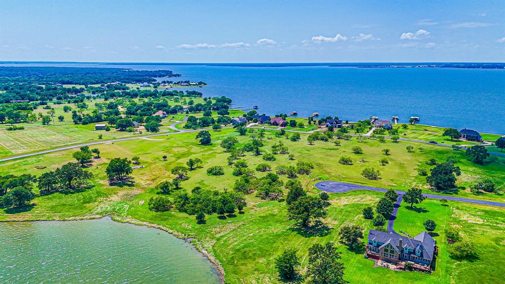 L77 R Moonlight Bay Court Streetman, TX 75859 - Photo 12 of 30 a view of a city with an ocean