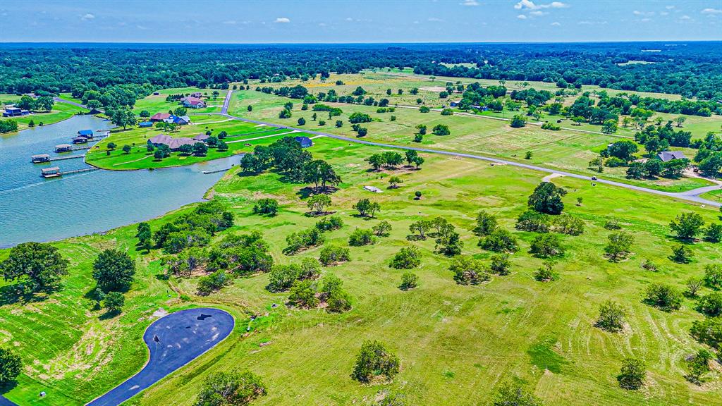L77 R Moonlight Bay Court Streetman, TX 75859 - Photo 16 of 30 a view of a garden with an outdoor space