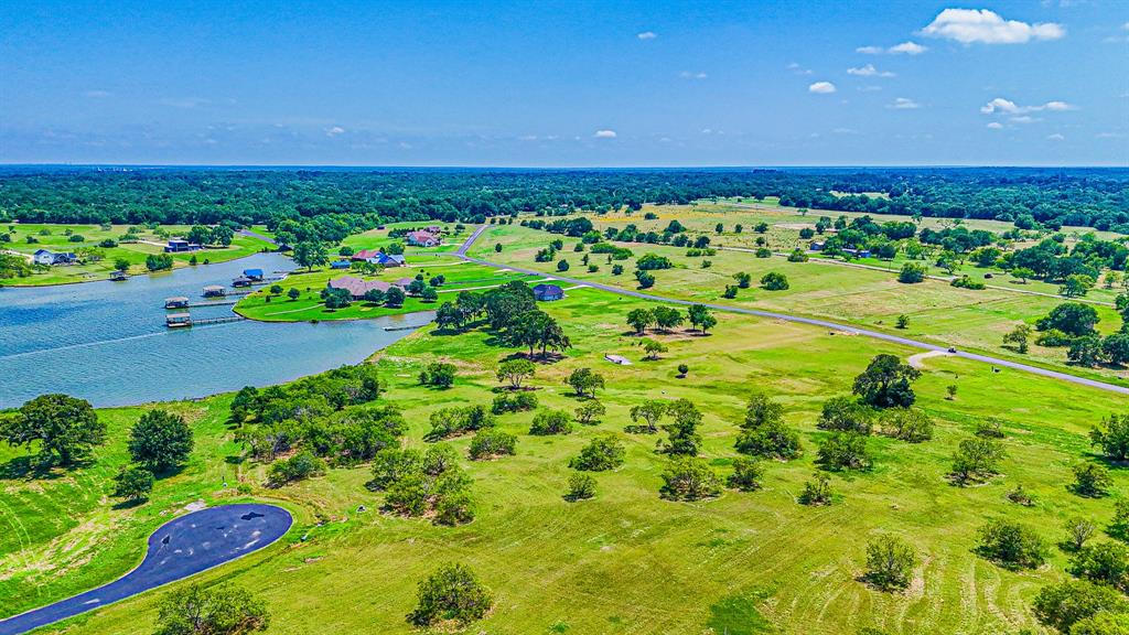 L77 R Moonlight Bay Court Streetman, TX 75859 - Photo 17 of 30 a view of a garden with an outdoor space