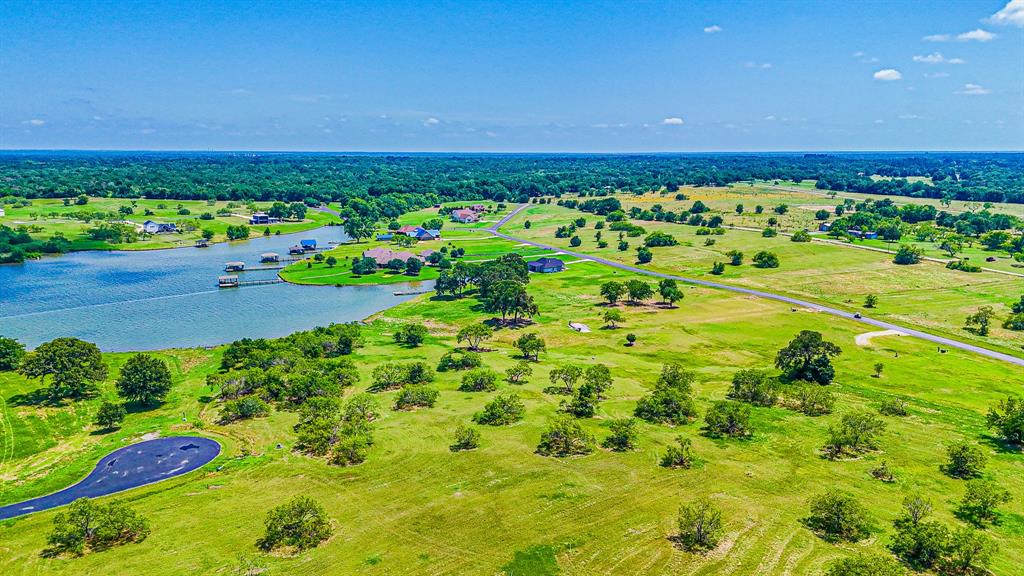 L77 R Moonlight Bay Court Streetman, TX 75859 - Photo 18 of 30 a view of a garden with an outdoor space