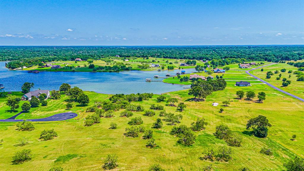 L77 R Moonlight Bay Court Streetman, TX 75859 - Photo 20 of 30 a view of yard with green space