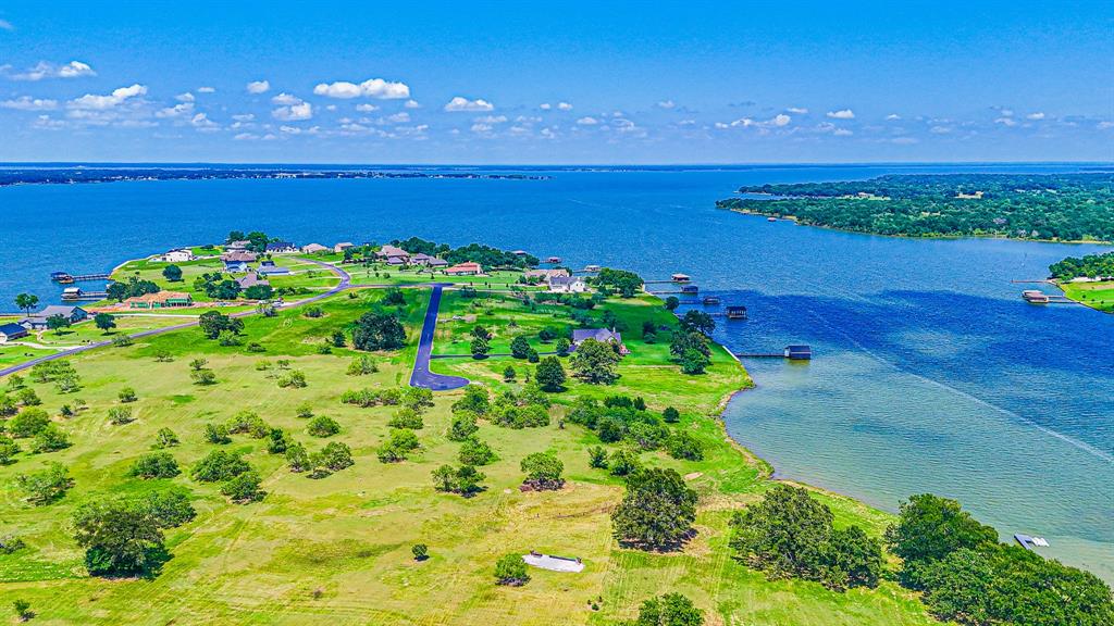 L77 R Moonlight Bay Court Streetman, TX 75859 - Photo 2 of 30 a view of an ocean and a building