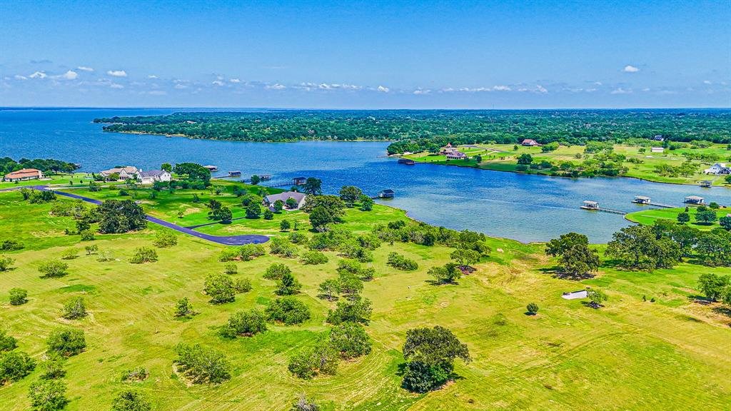 L77 R Moonlight Bay Court Streetman, TX 75859 - Photo 22 of 30 a view of a garden with an outdoor space