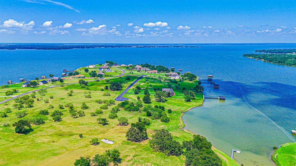 L77 R Moonlight Bay Court Streetman, TX 75859 - Photo 4 of 30 a view of an ocean and a yard