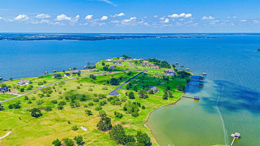 L77 R Moonlight Bay Court Streetman, TX 75859 - Photo 5 of 30 a view of a lake in middle of a building