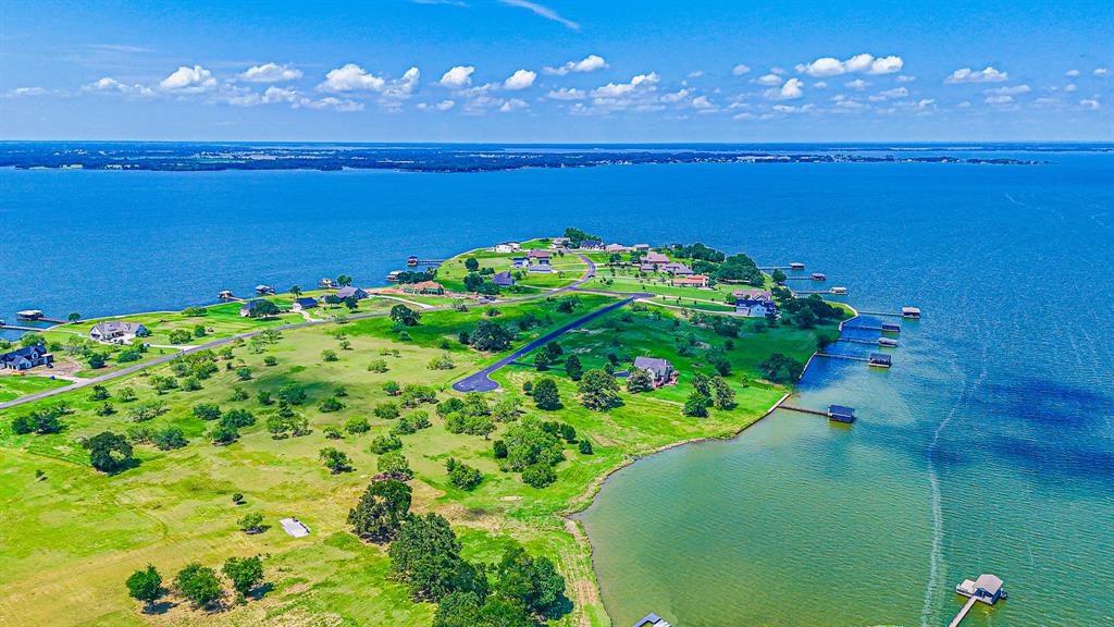 L77 R Moonlight Bay Court Streetman, TX 75859 - Photo 6 of 30 a view of a lake in middle of a building