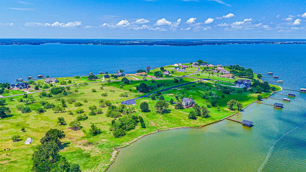 L77 R Moonlight Bay Court Streetman, TX 75859 - Photo 7 of 30 a view of a lake with a big yard