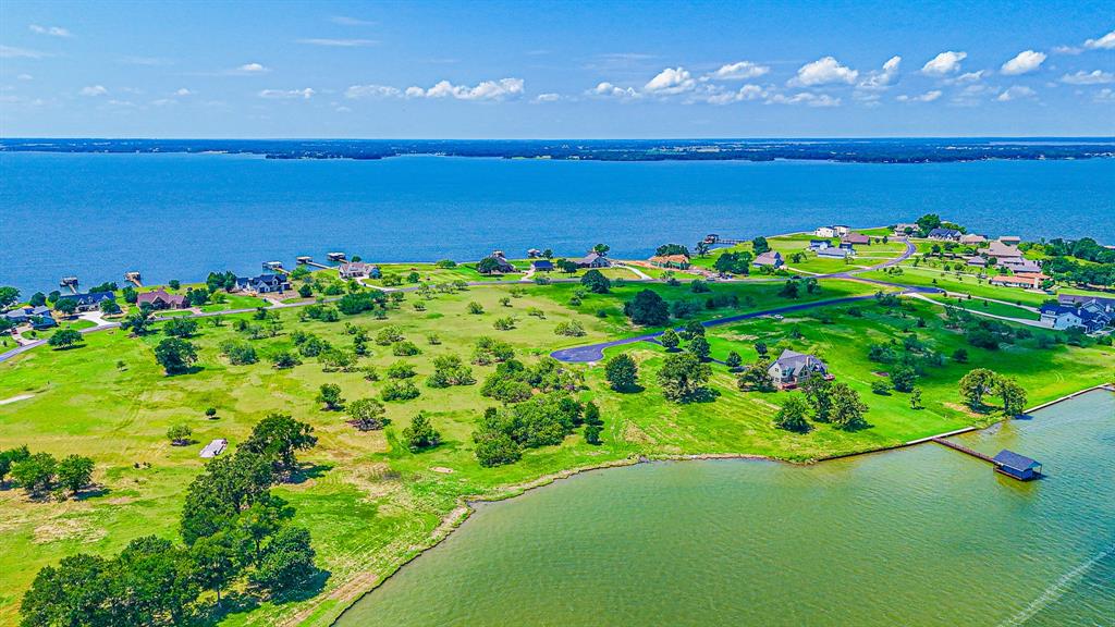 L77 R Moonlight Bay Court Streetman, TX 75859 - Photo 8 of 30 a view of a lake with a big yard
