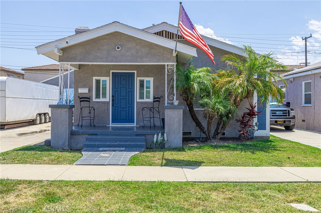 2548 East Washington Street Carson, CA 90810 - Photo 1 of 44 a front view of a house with a yard
