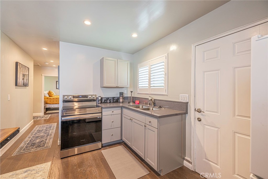 2548 East Washington Street Carson, CA 90810 - Photo 13 of 44 a kitchen with a stove and a sink