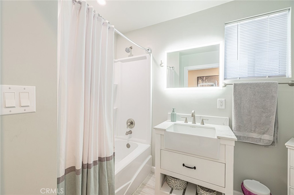 2548 East Washington Street Carson, CA 90810 - Photo 17 of 44 a bathroom with a sink double vanity and a mirror