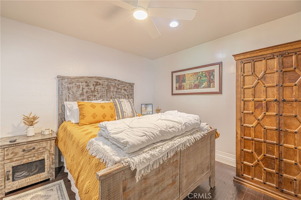2548 East Washington Street Carson, CA 90810 - Photo 18 of 44 a bedroom with a bed and a painting on the wall