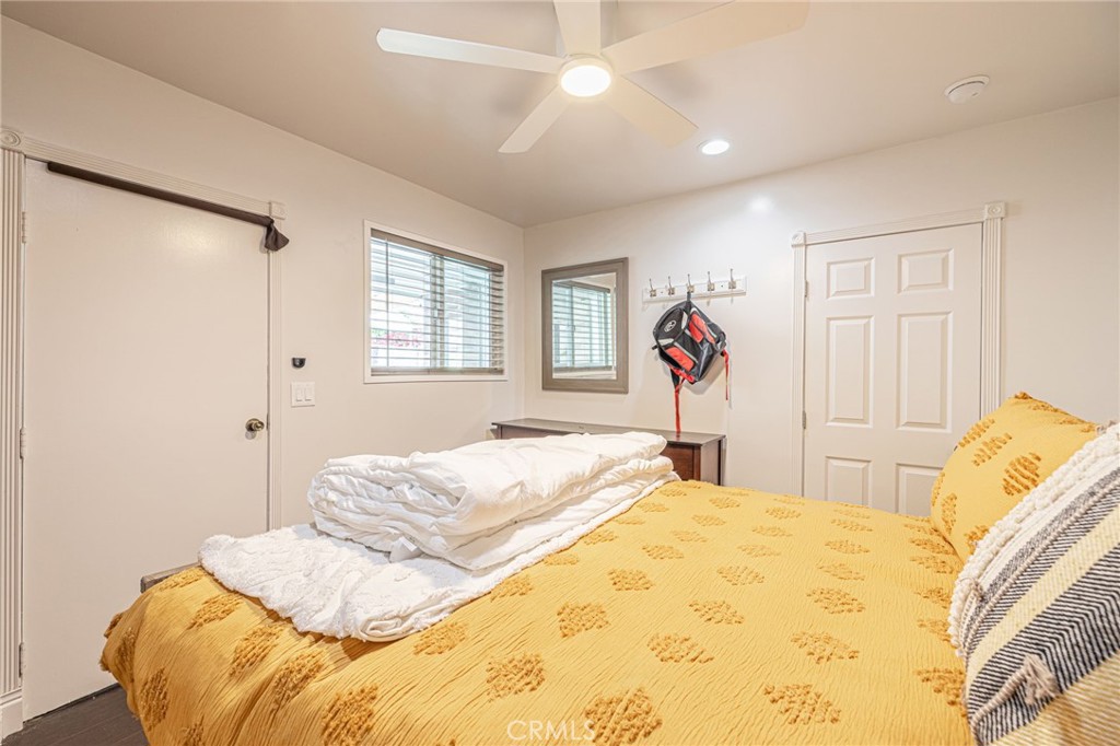 2548 East Washington Street Carson, CA 90810 - Photo 19 of 44 a bedroom with a bed and a chandelier