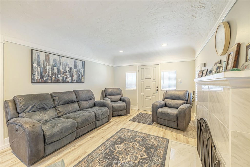 2548 East Washington Street Carson, CA 90810 - Photo 24 of 44 a living room with furniture and a painting