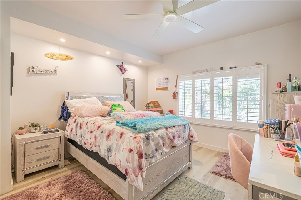 2548 East Washington Street Carson, CA 90810 - Photo 30 of 44 a bed room with a bed and a couch