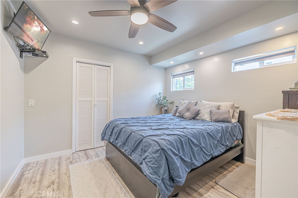 2548 East Washington Street Carson, CA 90810 - Photo 34 of 44 a bedroom with a bed and a chandelier