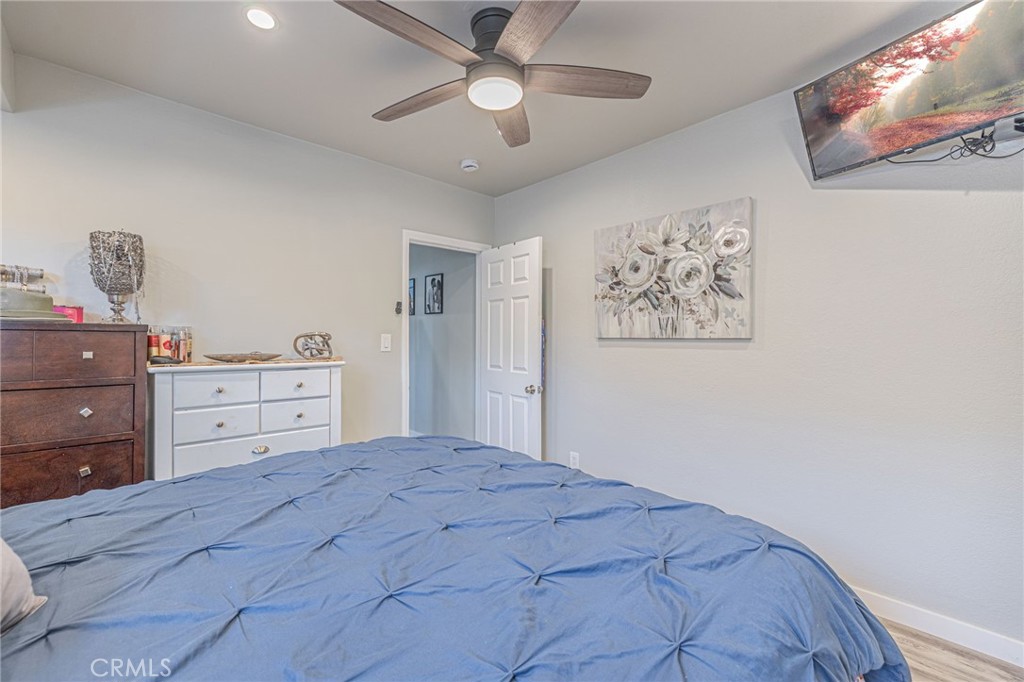 2548 East Washington Street Carson, CA 90810 - Photo 35 of 44 a bedroom with a bed and a chandelier