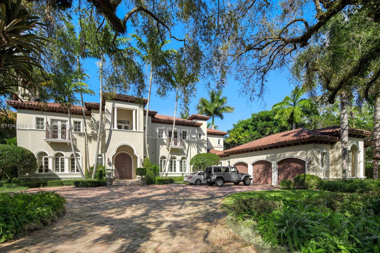 5001 Pine Drive Miami, FL 33143 - Photo 1 of 32 a front view of a house with a yard