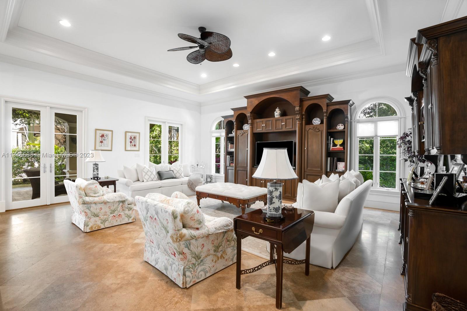 5001 Pine Drive Miami, FL 33143 - Photo 9 of 32 a living room with furniture and a large window