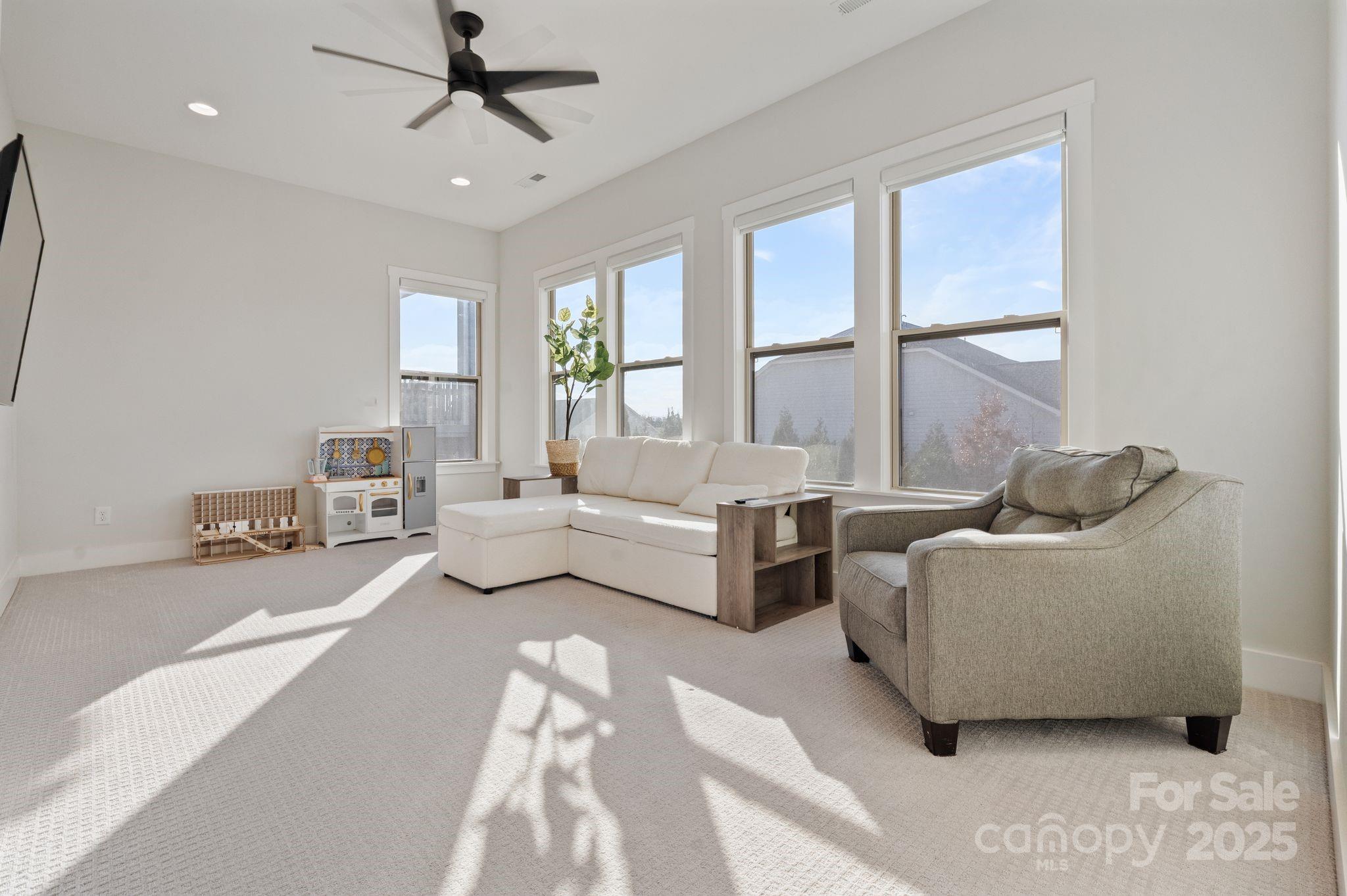 2075 Masons Bend Drive Fort Mill, SC 29708 - Photo 17 of 47 a spacious bedroom with a bed and large windows