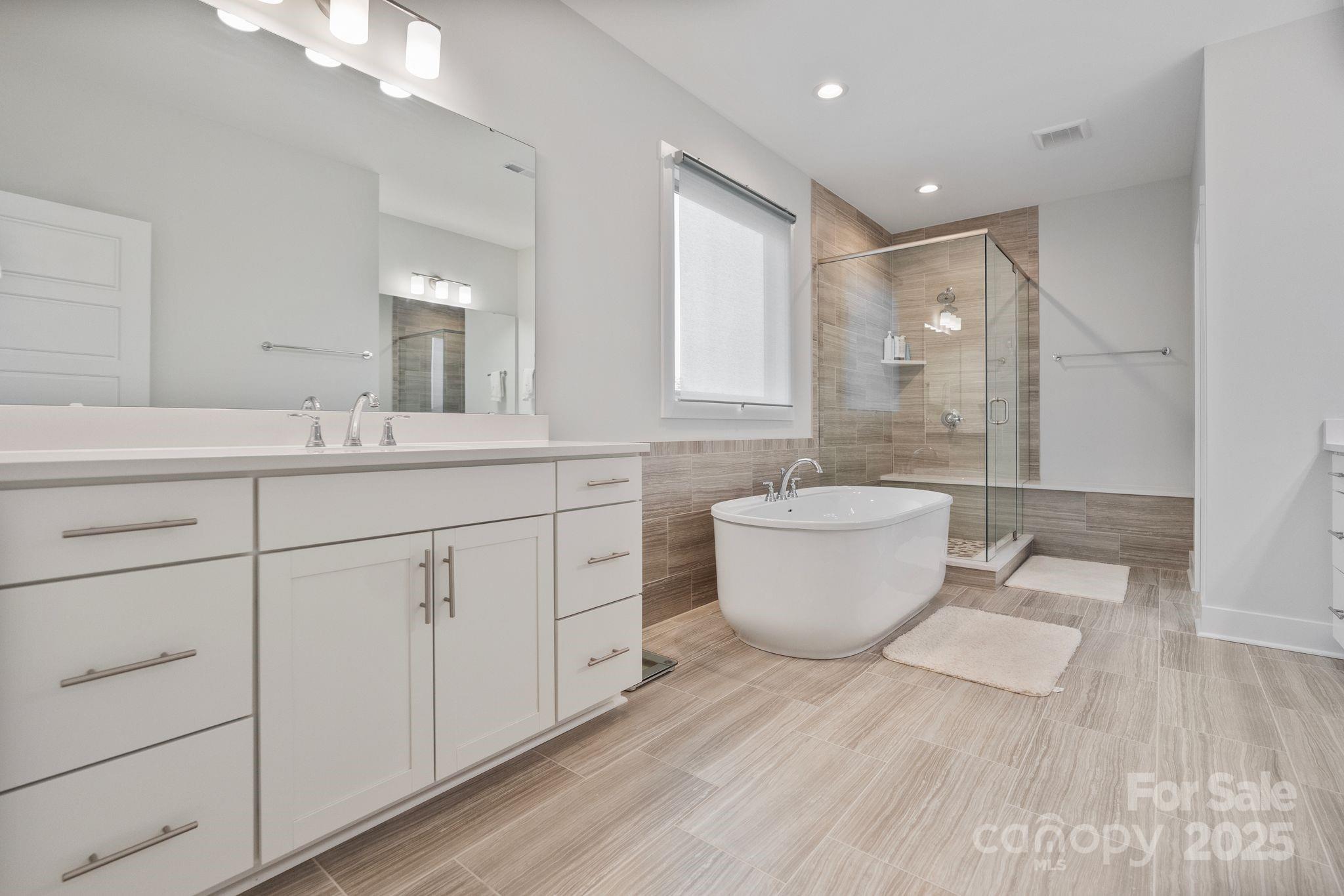 2075 Masons Bend Drive Fort Mill, SC 29708 - Photo 23 of 47 a bathroom with a double vanity sink and a mirror
