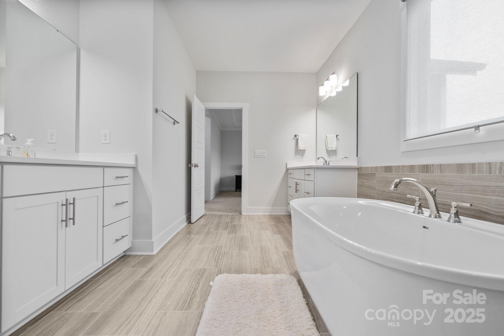 2075 Masons Bend Drive Fort Mill, SC 29708 - Photo 24 of 47 a view of a kitchen with white cabinets