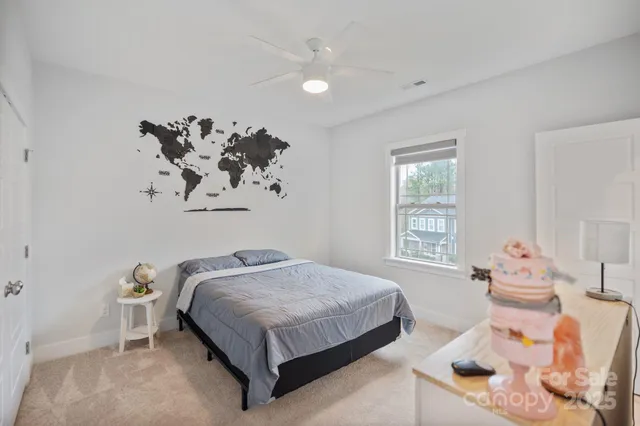 a bedroom with a bed and window