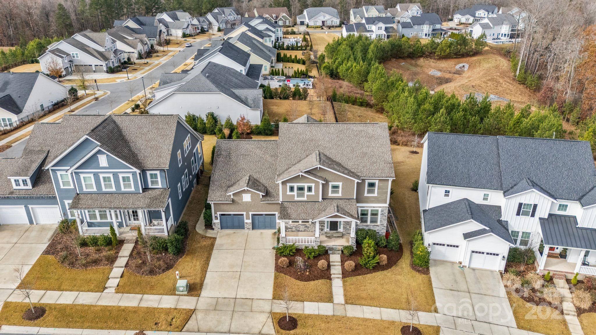 2075 Masons Bend Drive Fort Mill, SC 29708 - Photo 3 of 47 an aerial view of residential houses with outdoor space and parking