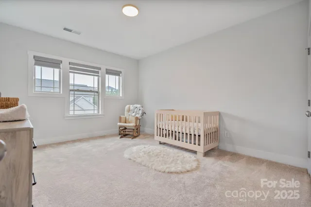 a room with a bed and a window