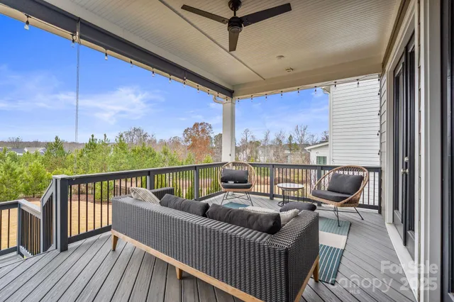 a view of a balcony with furniture