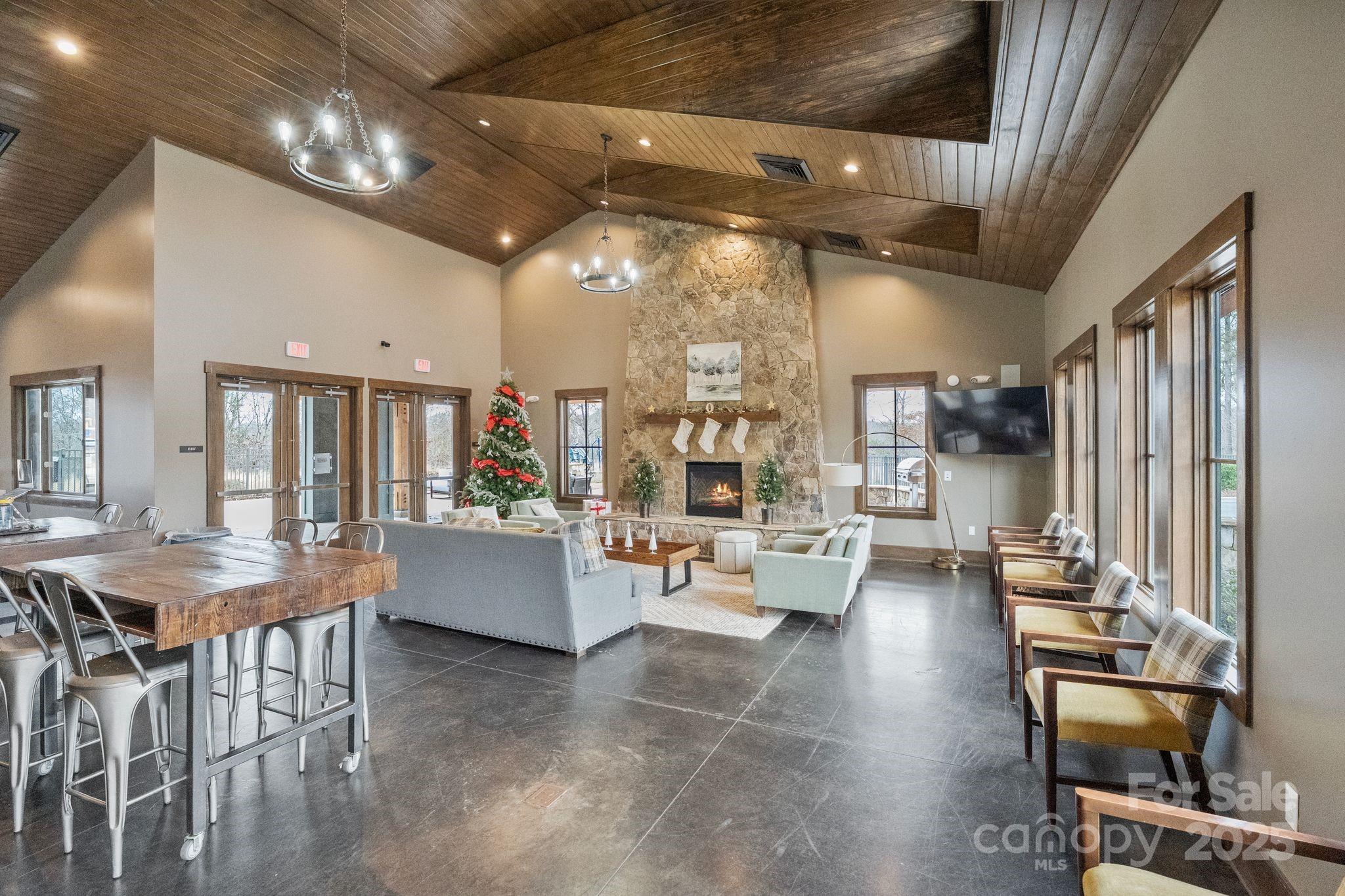 2075 Masons Bend Drive Fort Mill, SC 29708 - Photo 39 of 47 a living room with furniture and a chandelier