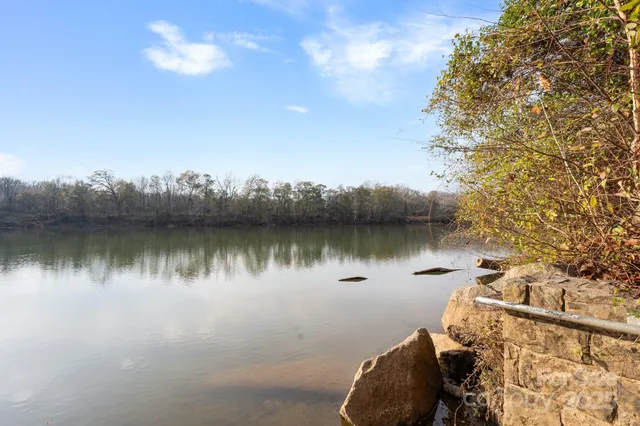 an aerial view of a house with a lake view
