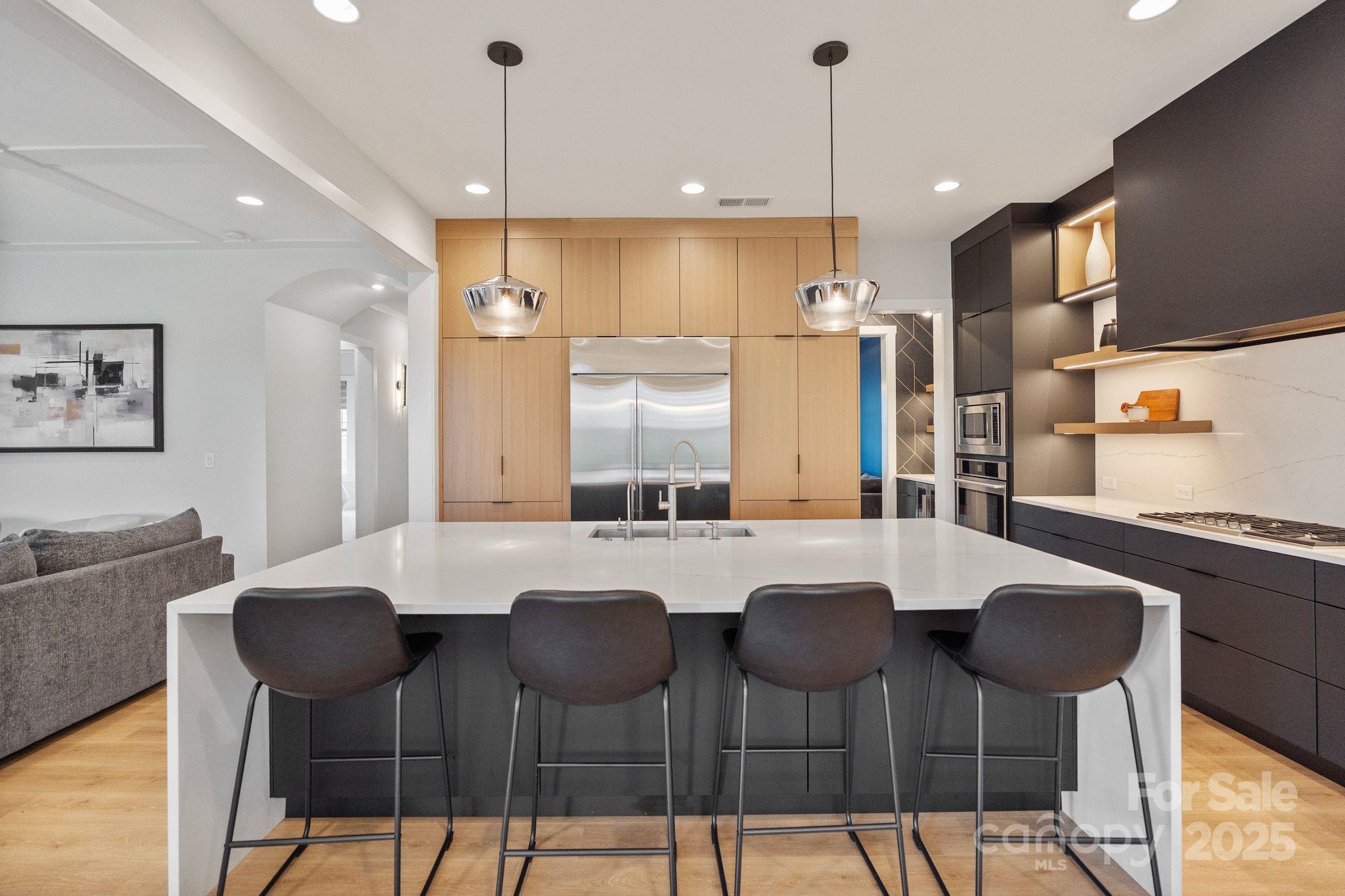 2075 Masons Bend Drive Fort Mill, SC 29708 - Photo 6 of 47 a kitchen with a dining table chairs and refrigerator