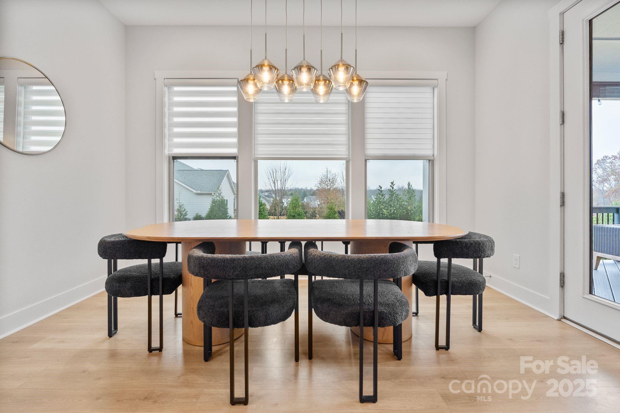 2075 Masons Bend Drive Fort Mill, SC 29708 - Photo 10 of 47 a view of a dining room with furniture and windows