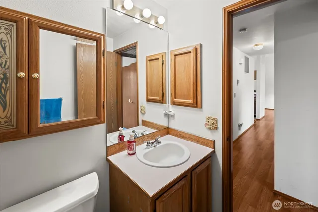 a view of entryway livingroom and hall with wooden floor