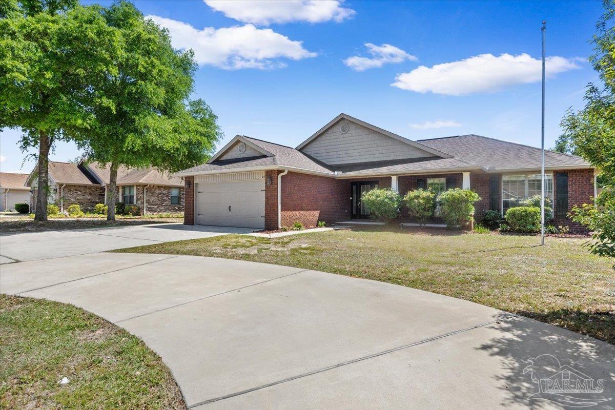 4015 Berry Circle Pace, FL 32571 - Photo 2 of 48 a house with outdoor space