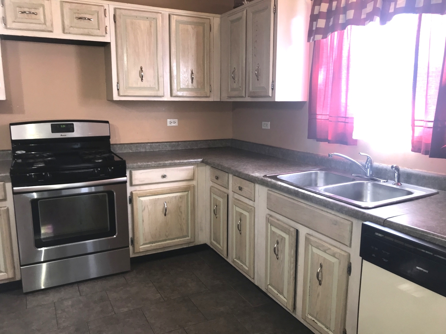 54 Cloverleaf Road Matteson, IL 60443 - Photo 6 of 13 a kitchen with granite countertop white cabinets and stainless steel appliances