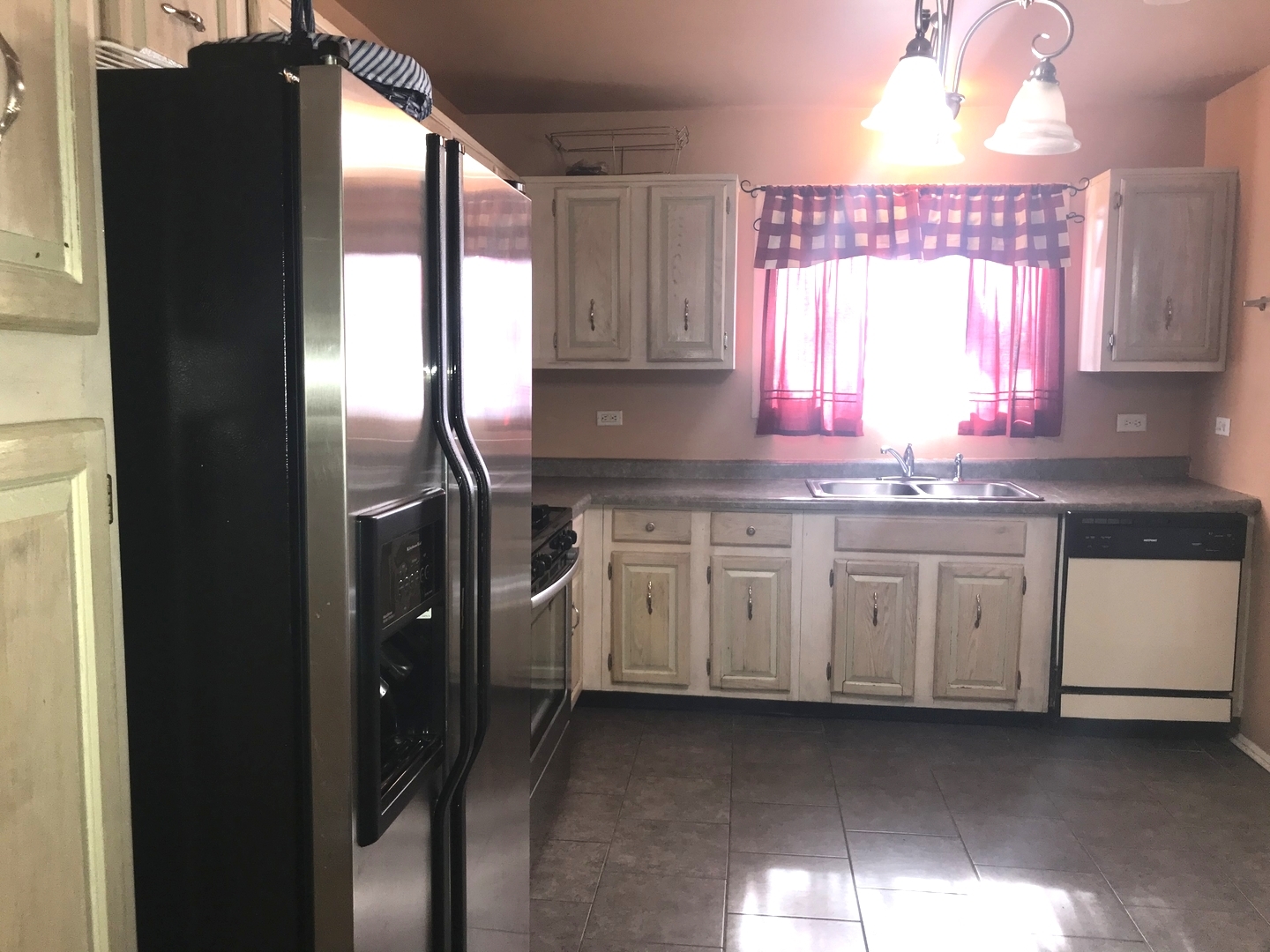 54 Cloverleaf Road Matteson, IL 60443 - Photo 7 of 13 a kitchen with granite countertop white cabinets and window