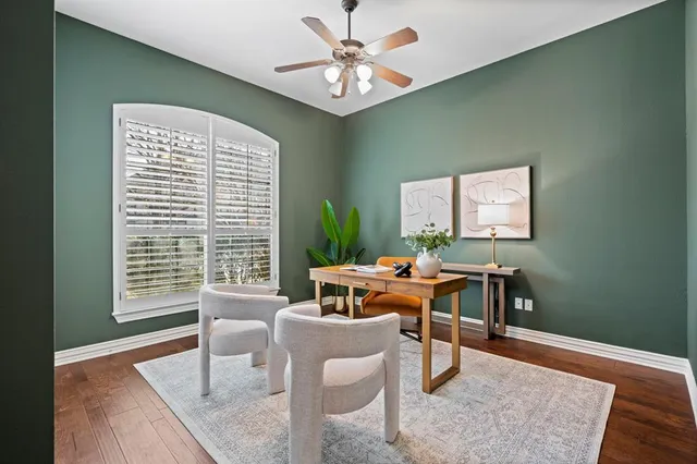 a living room with furniture a window and a table