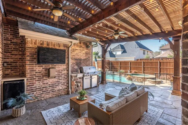 a outdoor living space with furniture and a fireplace