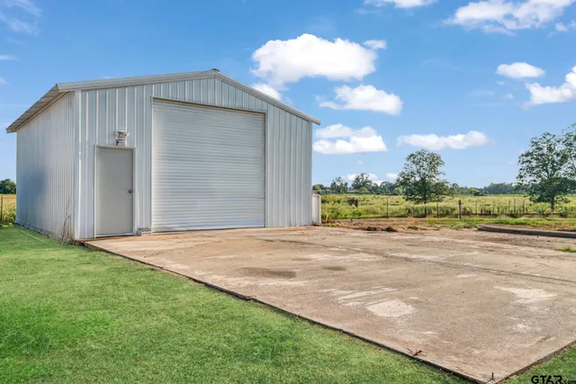 a view of a backyard of the house